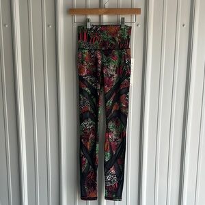 Lululemon Athletica Red and Green Leggings with Bold Floral Design